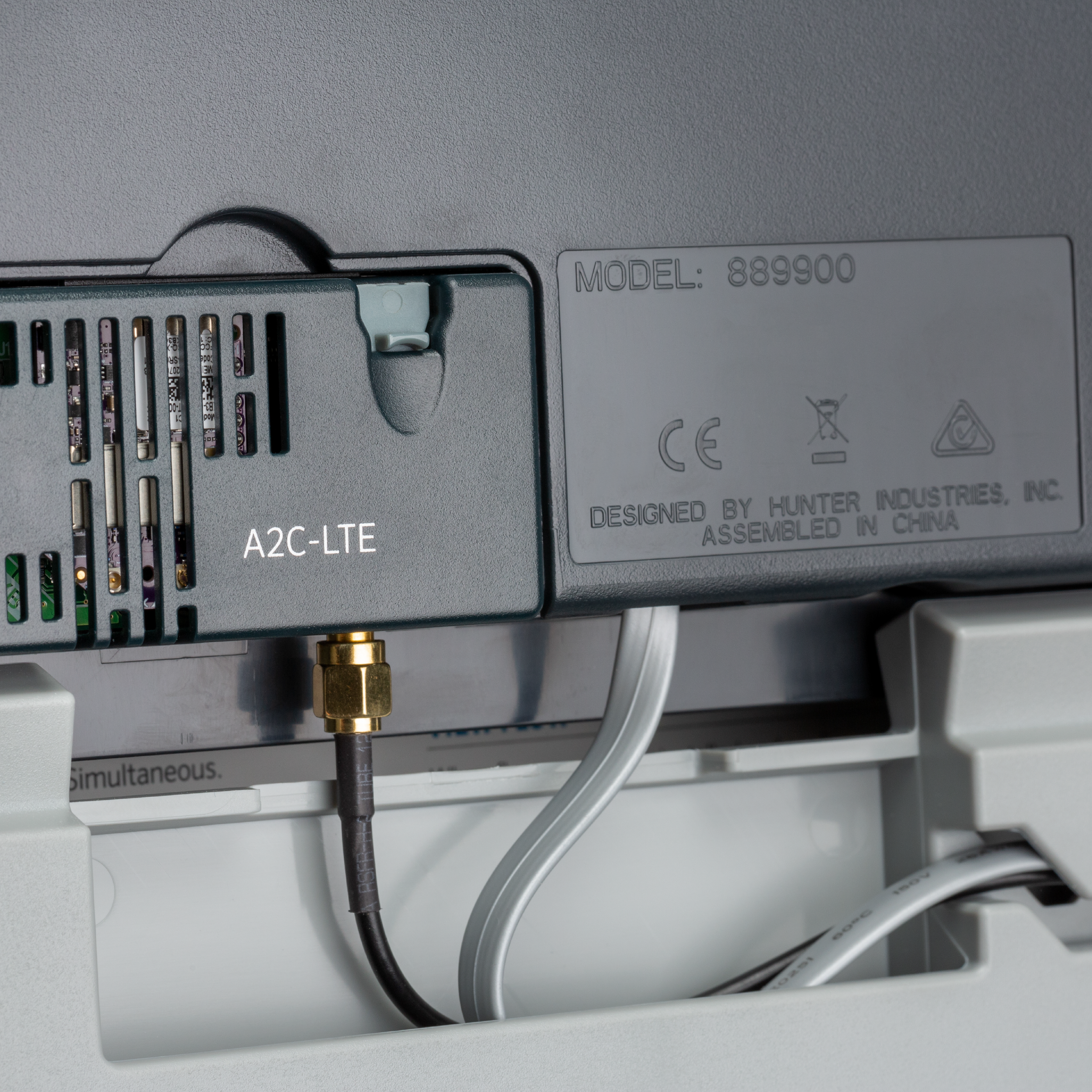 Plastic controller terminal block with A2C-LITE label and connected wires