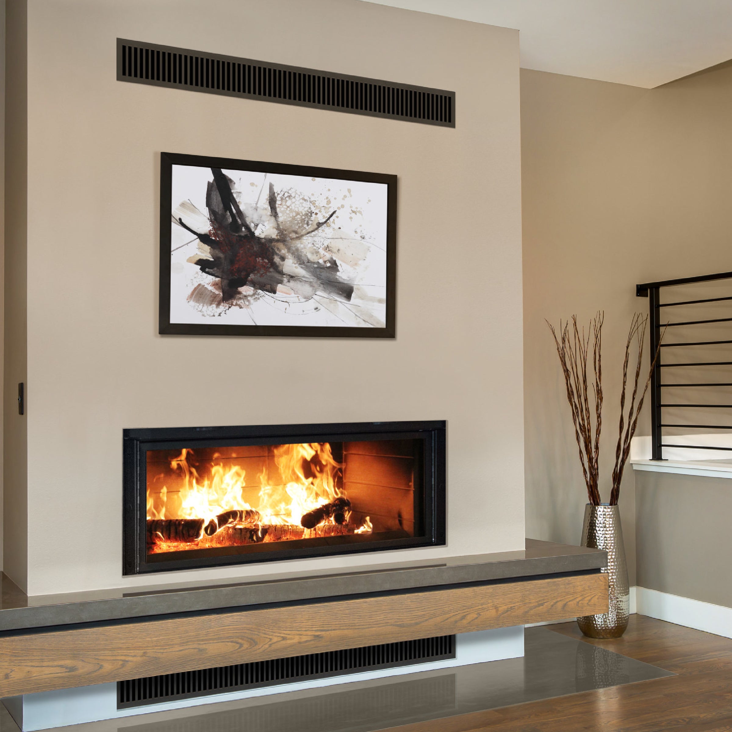 Linear fireplace with rectangular glass front and burning flames in black surround