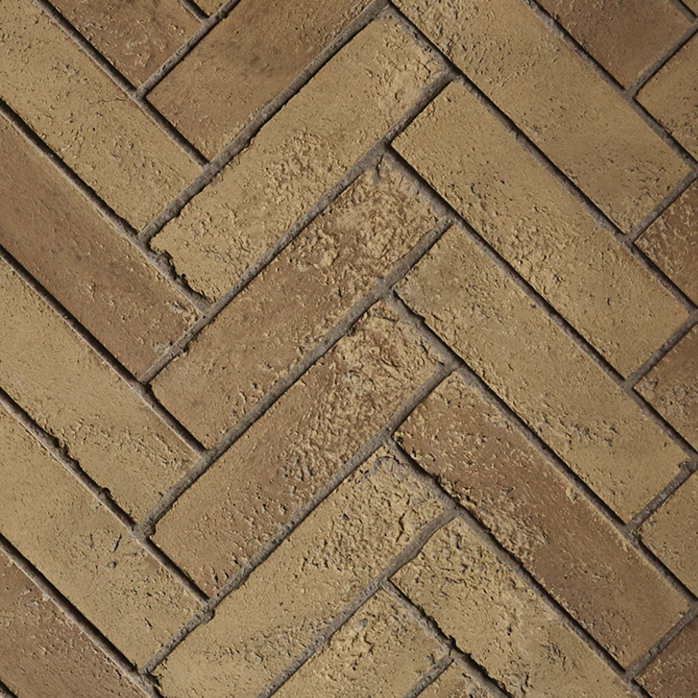 Brown brick herringbone pattern paving surface, interlocking rectangular blocks