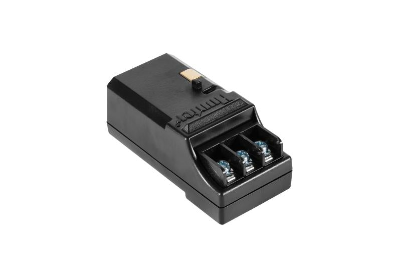 Black output module with 3-station connector ports and mounting tab