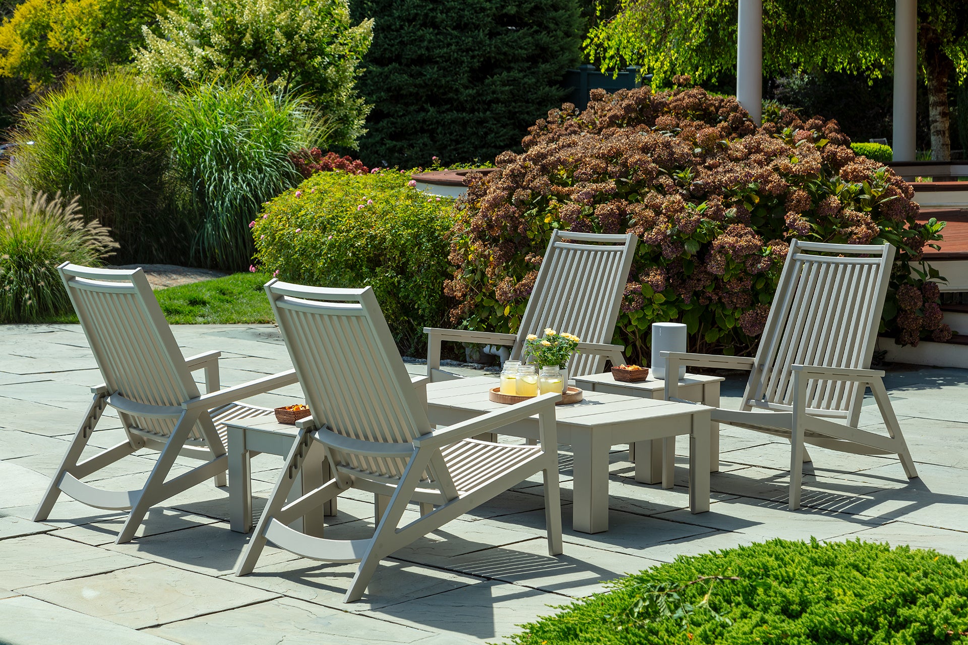 Set of recliner lounge chairs with slatted backs and seats, light charcoal frames